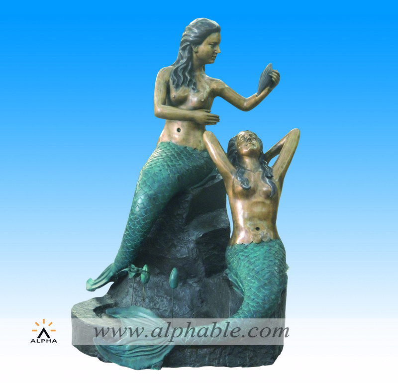 Bronze mermaid statues fountain