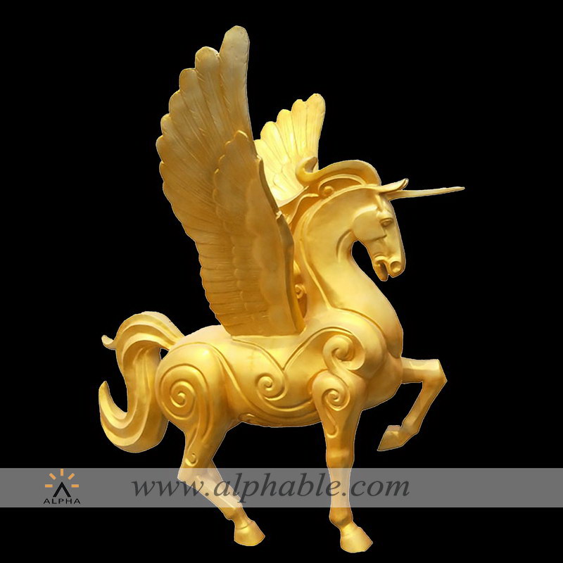 Golden abstract unicorn sculpture