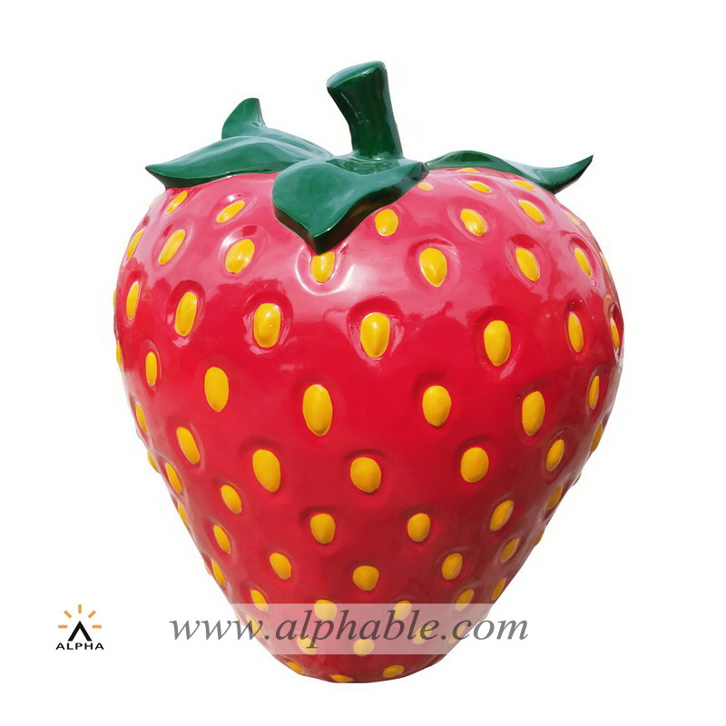 Large plastic strawberry sculpture