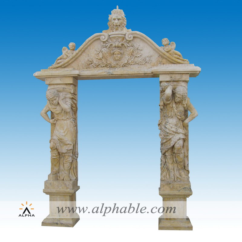 Yellow travertine door frame with statues