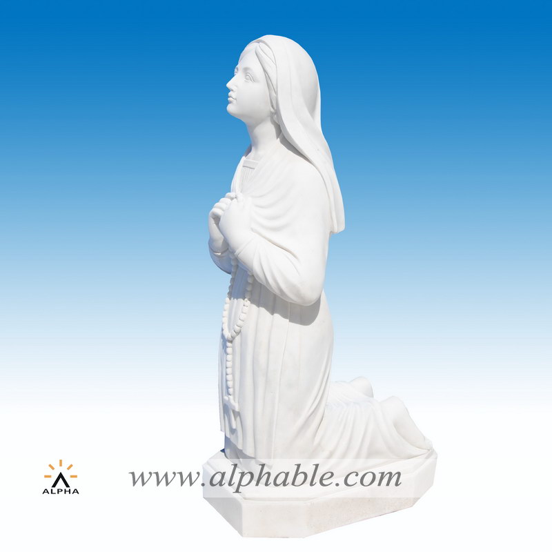 Carved white marble Saint Bernadette religious statue